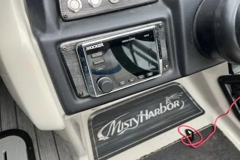 Slide: The Image of Misty Harbor S2385SU 2018 boat dashboard with Kicker audio system. - 7