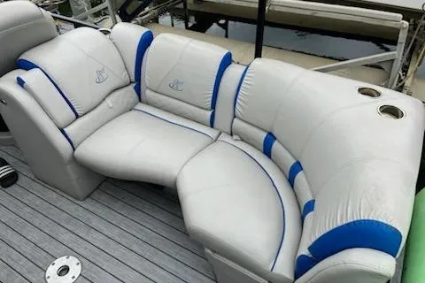Slide: The Image of 2018 Misty Harbor S2385SU pontoon boat seating with white and blue upholstery. - 8
