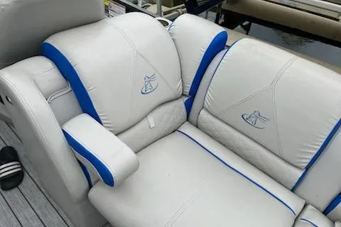 Slide: The Image of 2018 Misty Harbor S2385SU boat seats with blue accents and embroidered logos. - 9