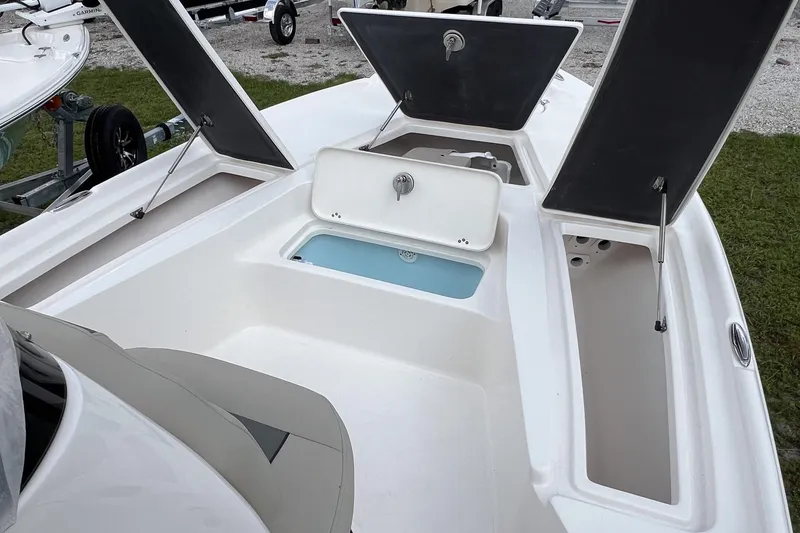 Slide: The Image of Open storage compartment on 2026 Key West 210 Bay Reef boat. - 10