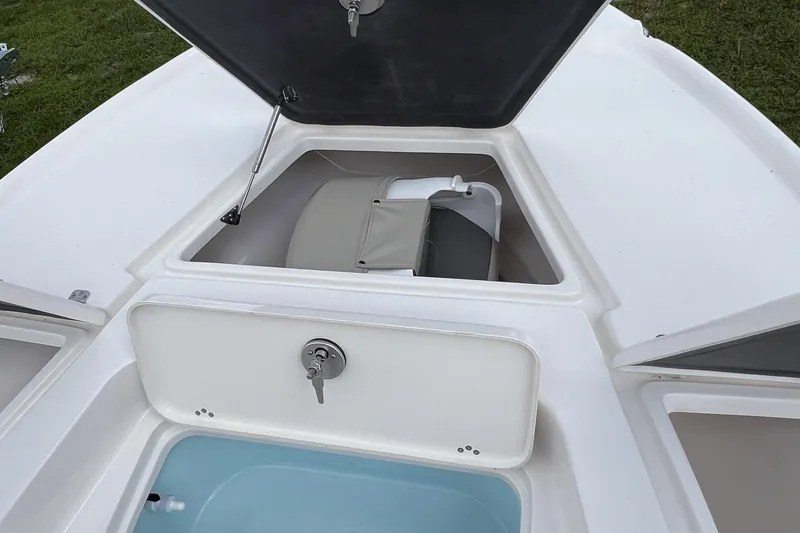 Slide: The Image of 2026 Key West 210 Bay Reef boat seat with gray and beige upholstery. - 11