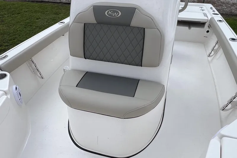 Slide: The Image of Interior view of 2026 Key West 210 Bay Reef boat, featuring seating and storage compartment. - 12