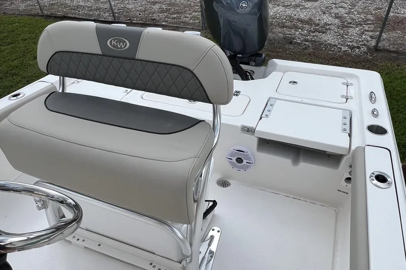 Slide: The Image of 2026 Key West 210 Bay Reef boat with cooler under seat. - 14