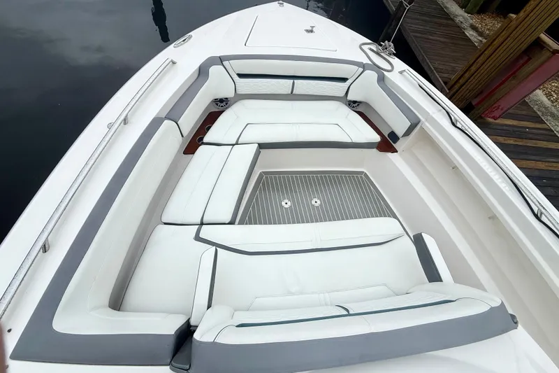 Slide: The Image of 2019 Tiara Sport 38 LS boat with spacious white seating area. - 24