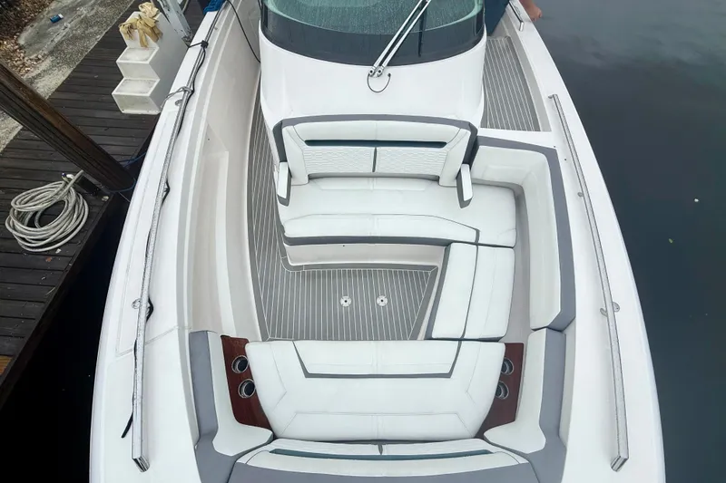 Slide: The Image of 2019 Tiara Sport 38 LS boat with luxurious white seating and sleek design. - 26