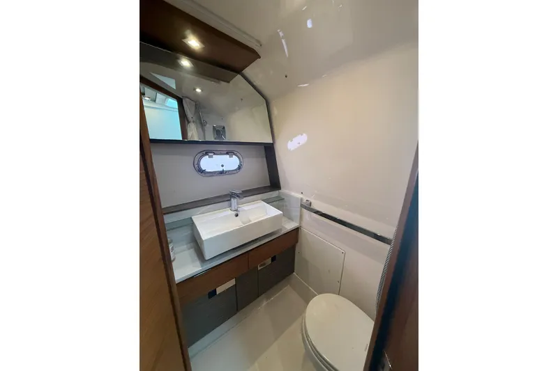 Slide: The Image of Luxurious bathroom interior of 2019 Tiara Sport 38 LS yacht, featuring modern sink and toilet. - 28