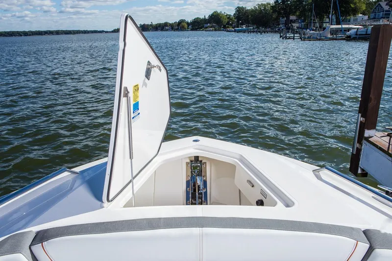 Slide: The Image of Manufacturer Provided Image: 2019 Tiara Sport 38 LS boat with open anchor locker on a lake. - 32