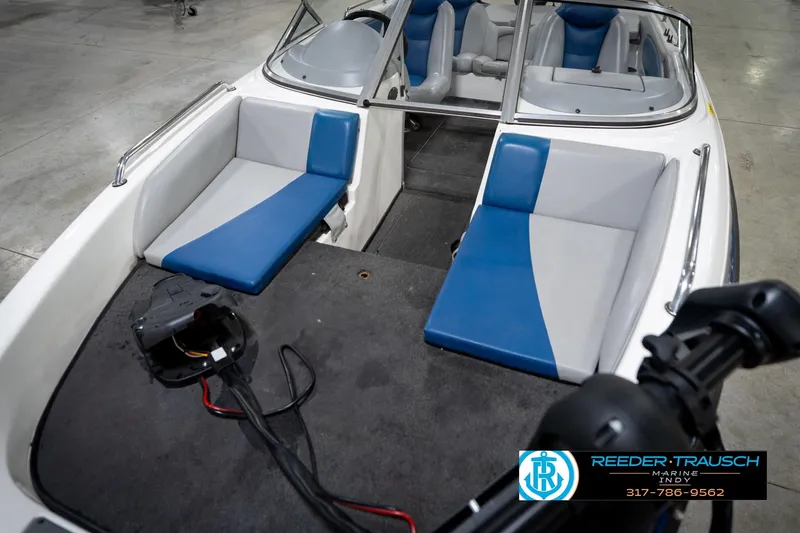 Slide: The Image of 2006 Skeeter SL 190 boat interior with blue and gray seating, showcased at Reeder-Trausch Marine. - 10