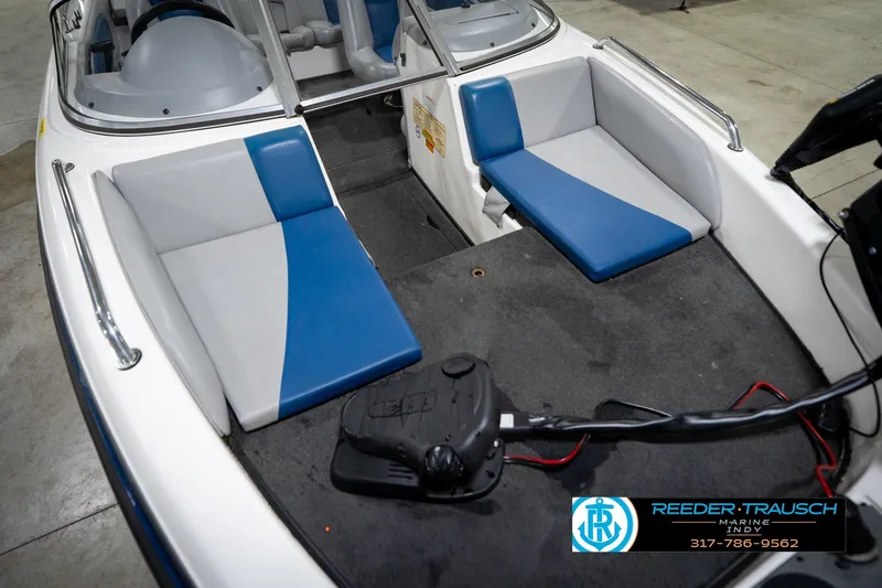 Slide: The Image of 2006 Skeeter SL 190 boat interior with blue and gray seating, Reeder-Trausch Marine logo. - 11