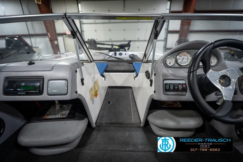 Slide: The Image of 2006 Skeeter SL 190 boat interior with steering wheel and dashboard controls. - 15