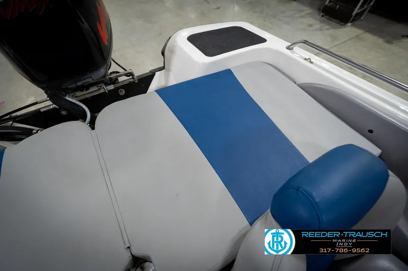 Slide: The Image of 2006 Skeeter SL 190 boat interior with blue and gray seating, Reeder-Trausch Marine logo. - 21