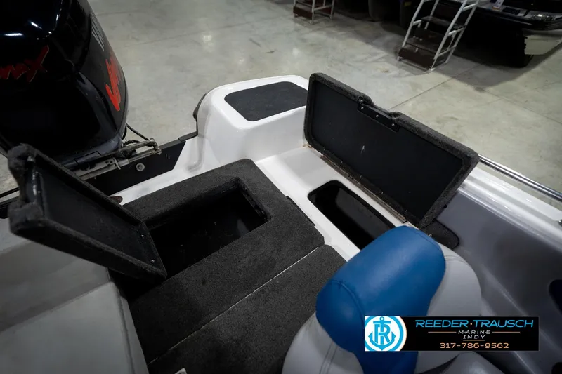 Slide: The Image of 2006 Skeeter SL 190 boat interior with open storage compartments and seating. - 22