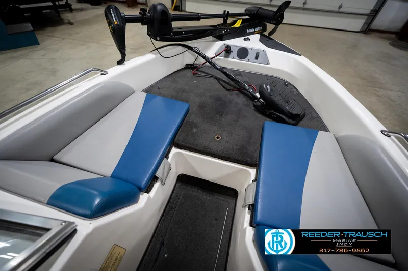 Slide: The Image of 2006 Skeeter SL 190 boat interior with blue and gray seating, Minn Kota trolling motor. - 23