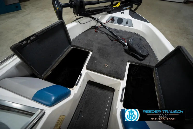Slide: The Image of 2006 Skeeter SL 190 boat interior with storage compartments open and Minn Kota trolling motor. - 24