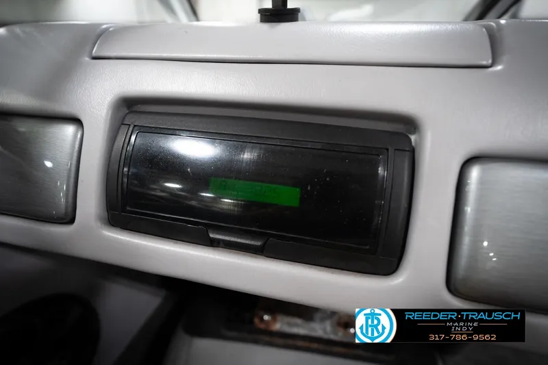 Slide: The Image of 2006 Skeeter SL 190 dashboard with digital display and Reeder Trausch Marine logo. - 25