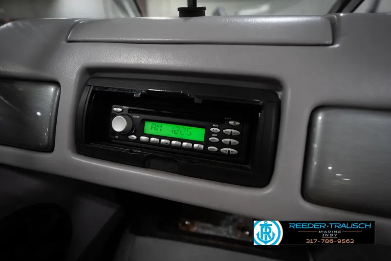Slide: The Image of 2006 Skeeter SL 190 dashboard with AM radio display at 12:25. - 26