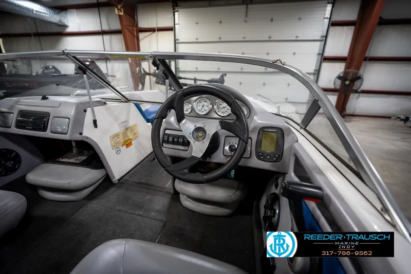 Slide: The Image of 2006 Skeeter SL 190 boat interior with steering wheel and dashboard controls. - 27
