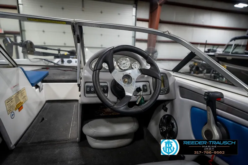 Slide: The Image of 2006 Skeeter SL 190 boat interior with steering wheel and control panel. - 28