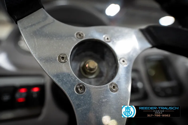 Slide: The Image of Close-up of a 2006 Skeeter SL 190 steering wheel, showcasing metallic details. - 29