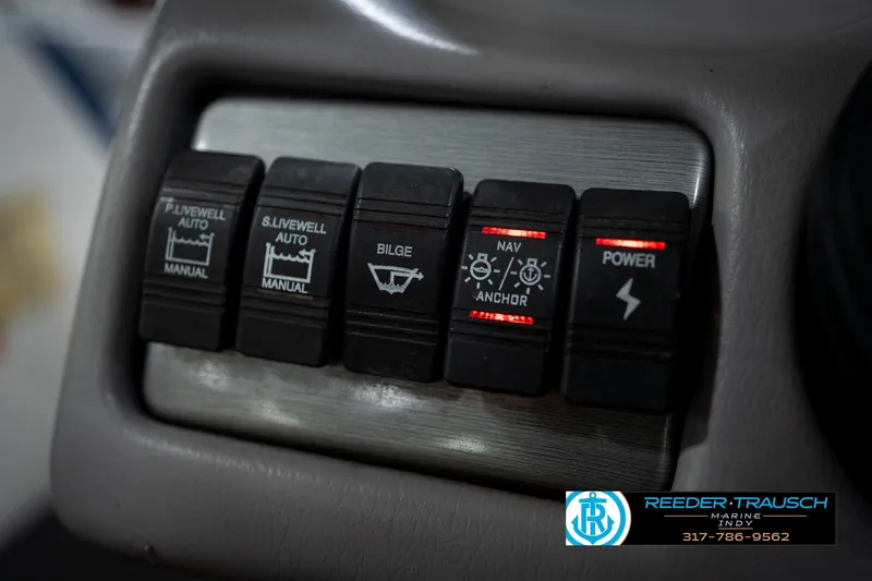 Slide: The Image of Control panel of a 2006 Skeeter SL 190 boat with various switches. - 30