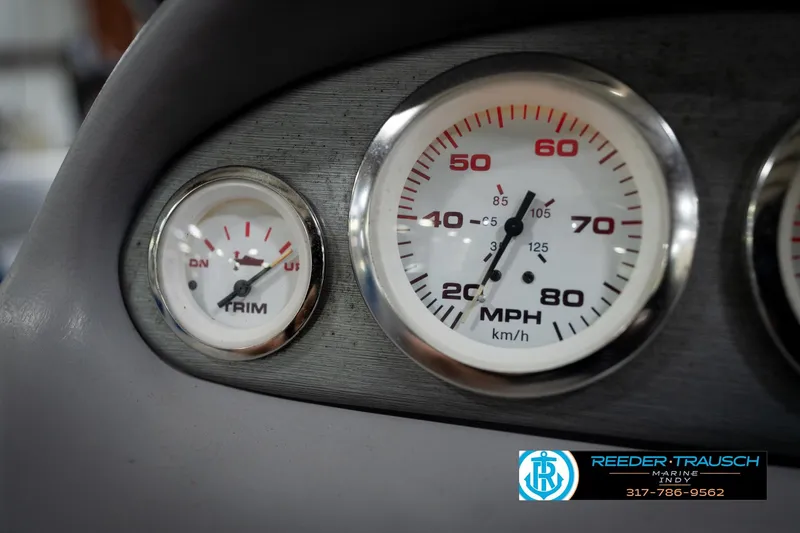 Slide: The Image of Close-up of 2006 Skeeter SL 190 speedometer and trim gauge on dashboard. - 31