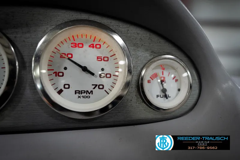 Slide: The Image of Close-up of 2006 Skeeter SL 190 boat dashboard with RPM and fuel gauges. - 32