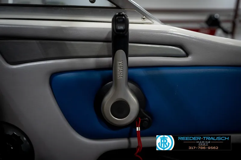 Slide: The Image of Interior of a 2006 Skeeter SL 190 boat featuring a Yamaha throttle control. - 36