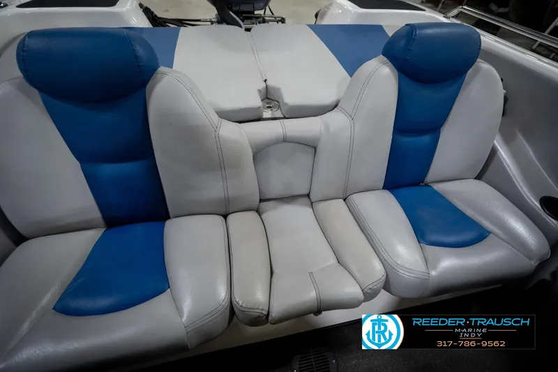 Slide: The Image of 2006 Skeeter SL 190 boat interior with blue and white seating. - 38