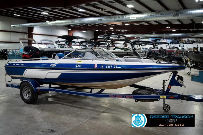 Slide: The Image of 2006 Skeeter SL 190 boat with Yamaha engine on trailer in showroom. - 4