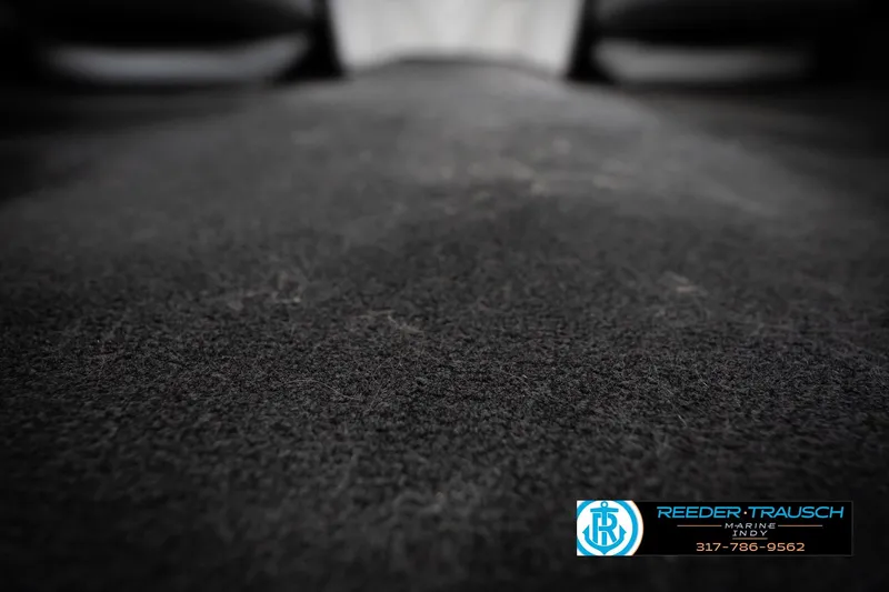 Slide: The Image of Close-up of 2006 Skeeter SL 190 boat carpet with Reeder-Trausch Marine logo. - 42