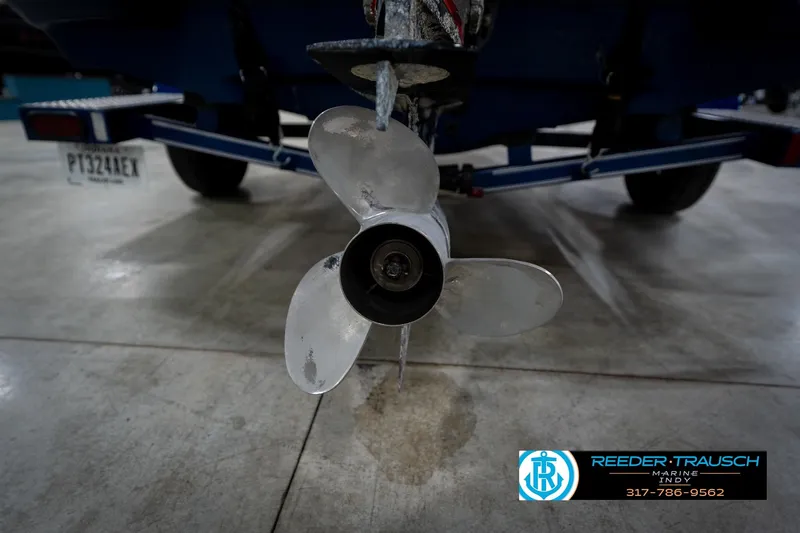 Slide: The Image of 2006 Skeeter SL 190 boat propeller and trailer in a garage setting. - 47