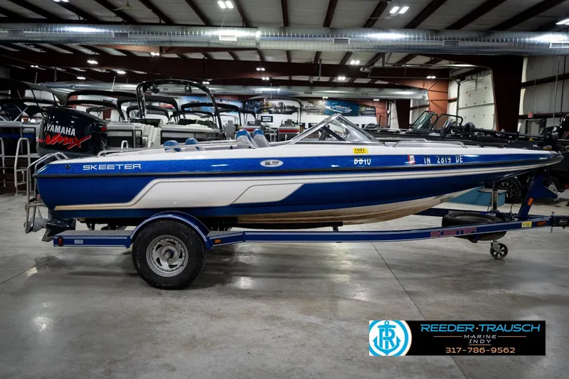 Slide: The Image of 2006 Skeeter SL 190 boat with Yamaha engine in showroom, side view. - 5