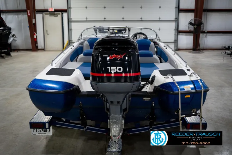 Slide: The Image of 2006 Skeeter SL 190 boat with Yamaha 150 engine in a garage setting. - 7