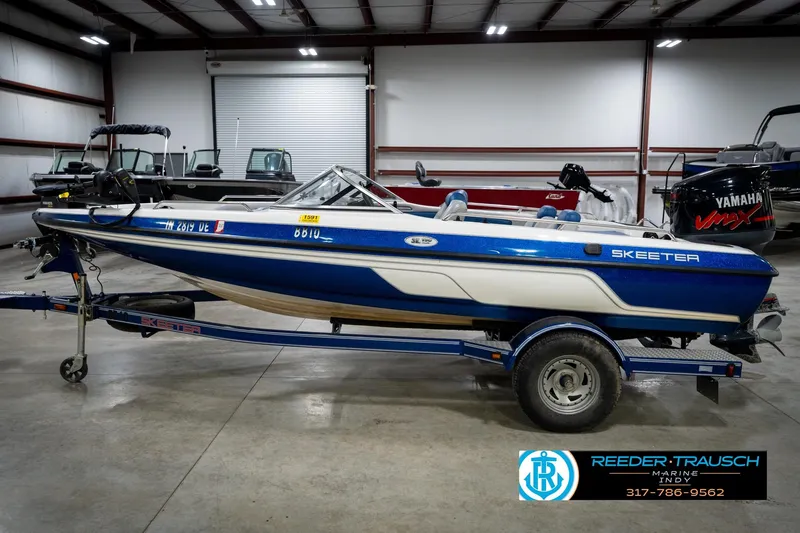Slide: The Image of 2006 Skeeter SL 190 boat with Yamaha engine on trailer in indoor showroom. - 9