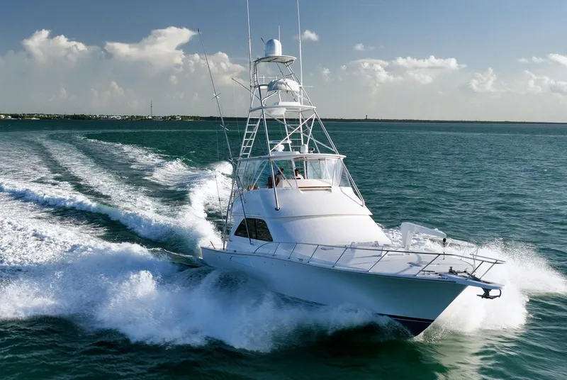 Slide: The Image of 2005 Viking 48 Convertible yacht cruising on open water. - 0