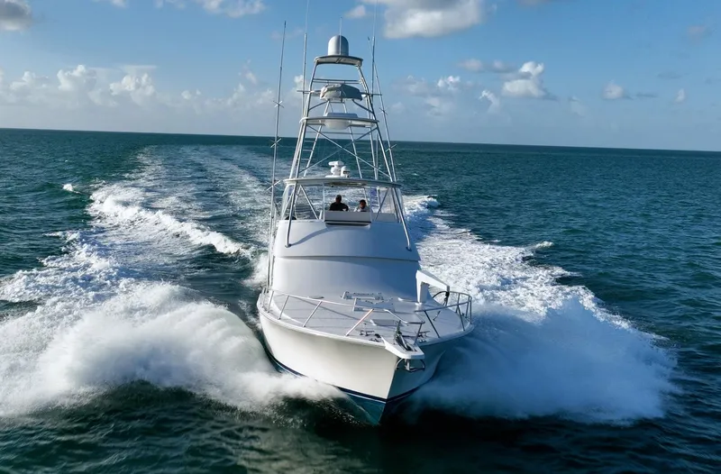 Slide: The Image of 2005 Viking 48 Convertible yacht cruising on open ocean waters. - 1