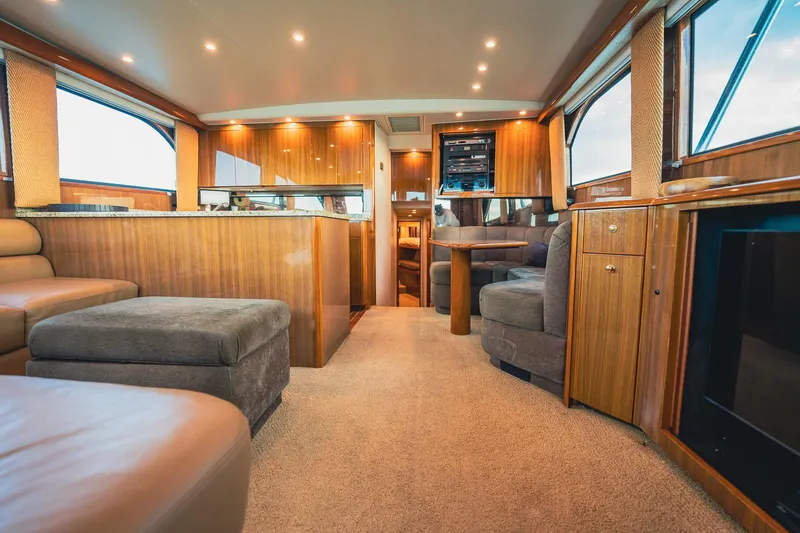 Slide: The Image of Luxurious interior of a 2005 Viking 48 Convertible yacht with elegant wood finishes. - 10