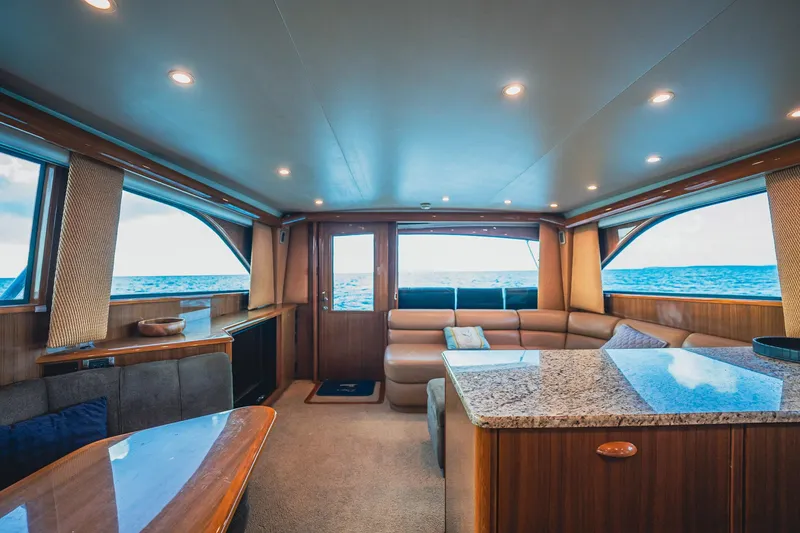Slide: The Image of Luxurious interior of a 2005 Viking 48 Convertible yacht with ocean view. - 17