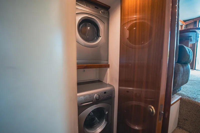 Slide: The Image of Stacked washer and dryer in 2005 Viking 48 Convertible yacht interior. - 33