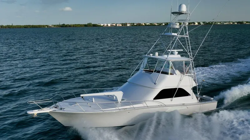 Slide: The Image of 2005 Viking 48 Convertible yacht cruising on open water. - 36