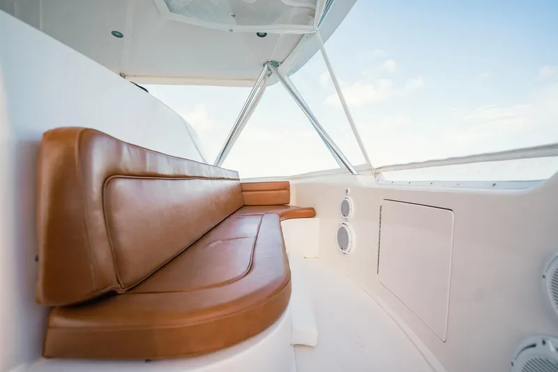 Slide: The Image of 2005 Viking 48 Convertible yacht interior with brown leather seating and white paneling. - 39