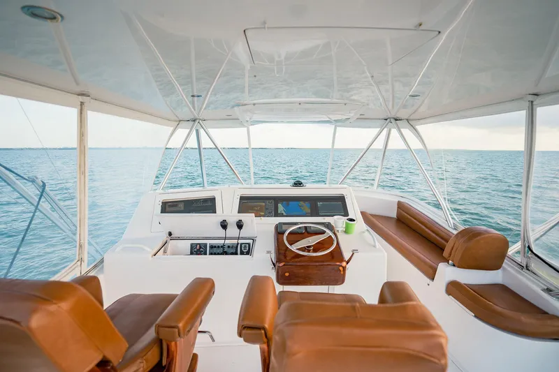 Slide: The Image of 2005 Viking 48 Convertible yacht interior with leather seats and ocean view. - 45