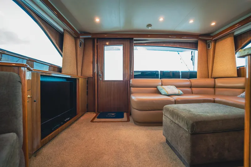 Slide: The Image of Luxurious interior of 2005 Viking 48 Convertible yacht with plush seating and modern amenities. - 5