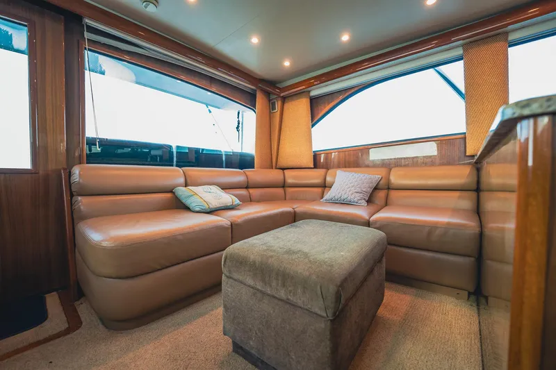 Slide: The Image of Luxurious interior of 2005 Viking 48 Convertible yacht with plush seating and elegant decor. - 6