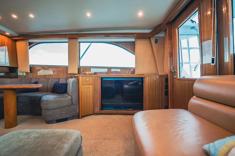 Slide: The Image of Luxurious interior of a 2005 Viking 48 Convertible yacht with plush seating and wood accents. - 7