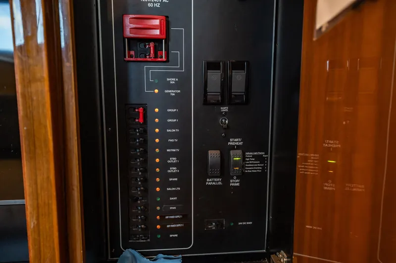 Slide: The Image of Electrical panel on a 2005 Viking 48 Convertible yacht, featuring switches and circuit breakers. - 8
