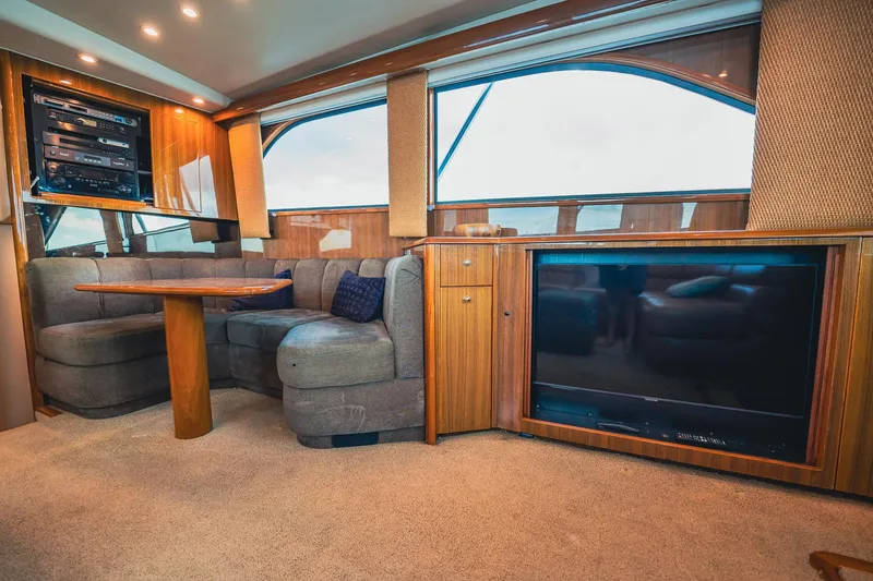 Slide: The Image of Luxurious interior of a 2005 Viking 48 Convertible yacht with plush seating and entertainment system. - 9