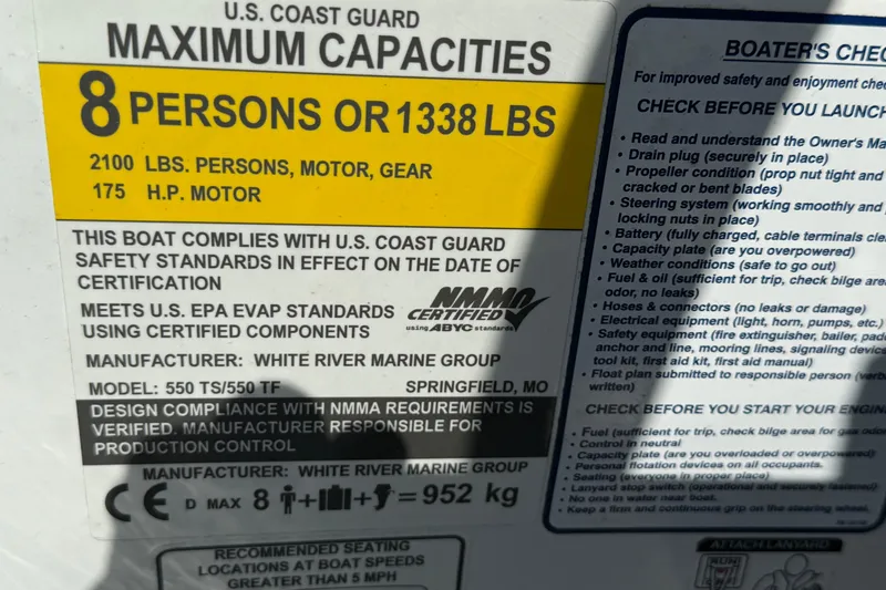 Slide: The Image of 2021 Tahoe 550 TS boat capacity label, 8 persons or 1338 lbs, safety compliance details. - 10