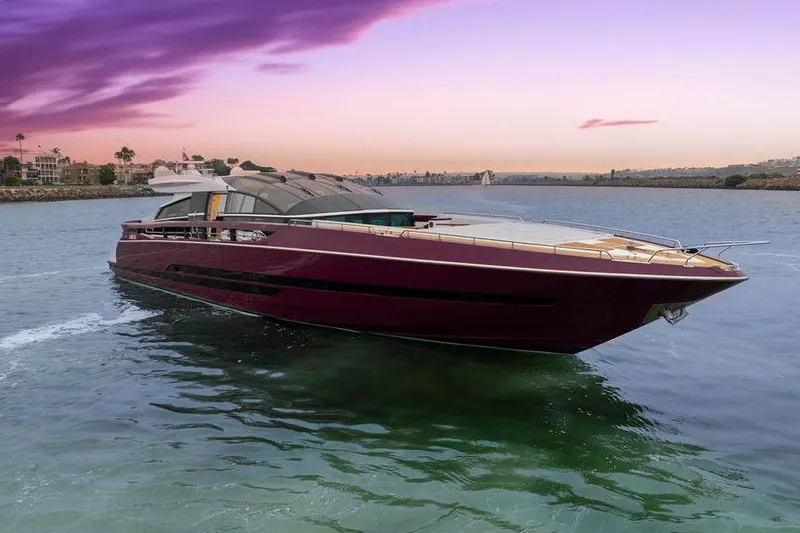 The Image of Luxurious 2011 Baia xxx yacht cruising at sunset with vibrant sky. - 0