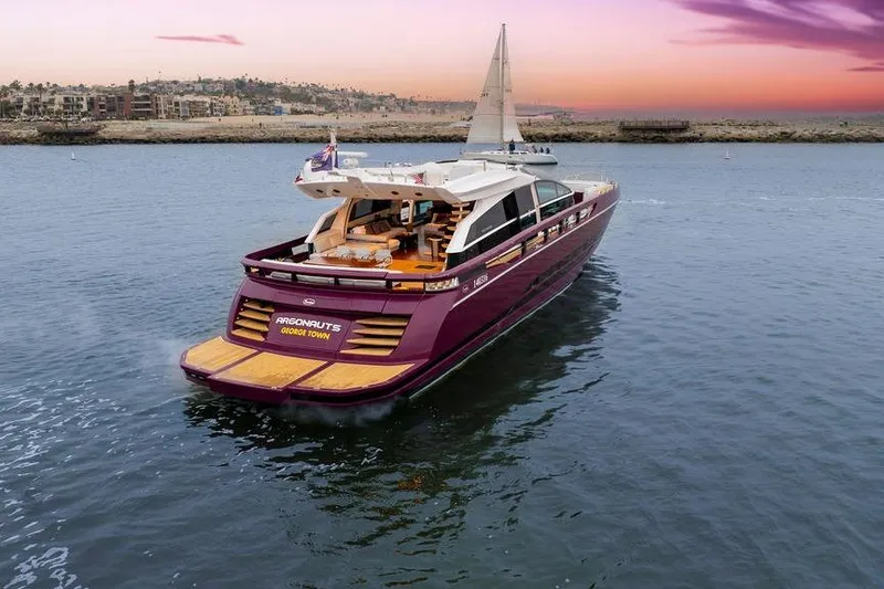 Slide: The Image of Luxurious 2011 Baia yacht sailing at sunset, featuring elegant design and spacious deck. - 10